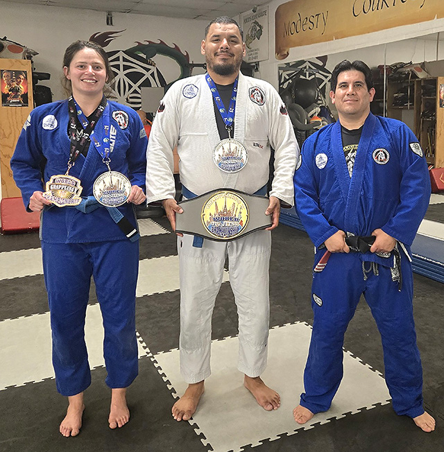 On Saturday, May 23, Emma Lopez and Jose Ramirez, students at Perce’s Kenpo Karate Studio in Fillmore, earned four medals at the Grappling X Jiu Jitsu World Championships in Azusa, California. Pictured (l-r) are Emma Lopez, Jose Ramirez and Professor Michael Torres. Photo credit Dayana Ramirez.