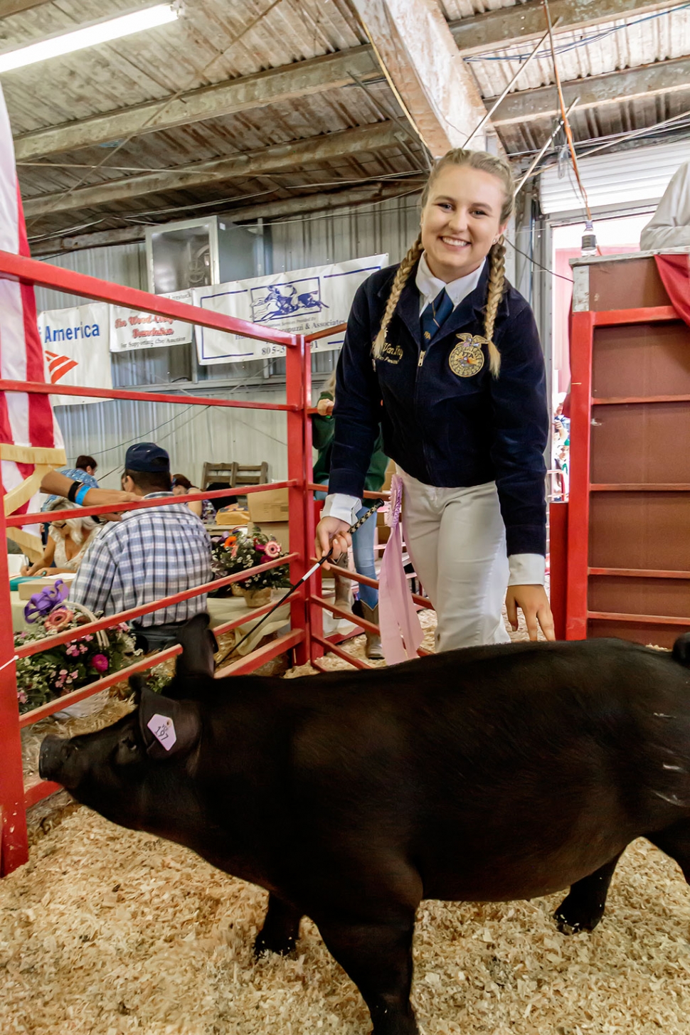 Pictured is Alexis Van Why who raised a 242 pound pig, named Bubba, and was awarded Reserve FFA Champion. Bubba was bought for $60 a pound at the auction. Total: $14,520.