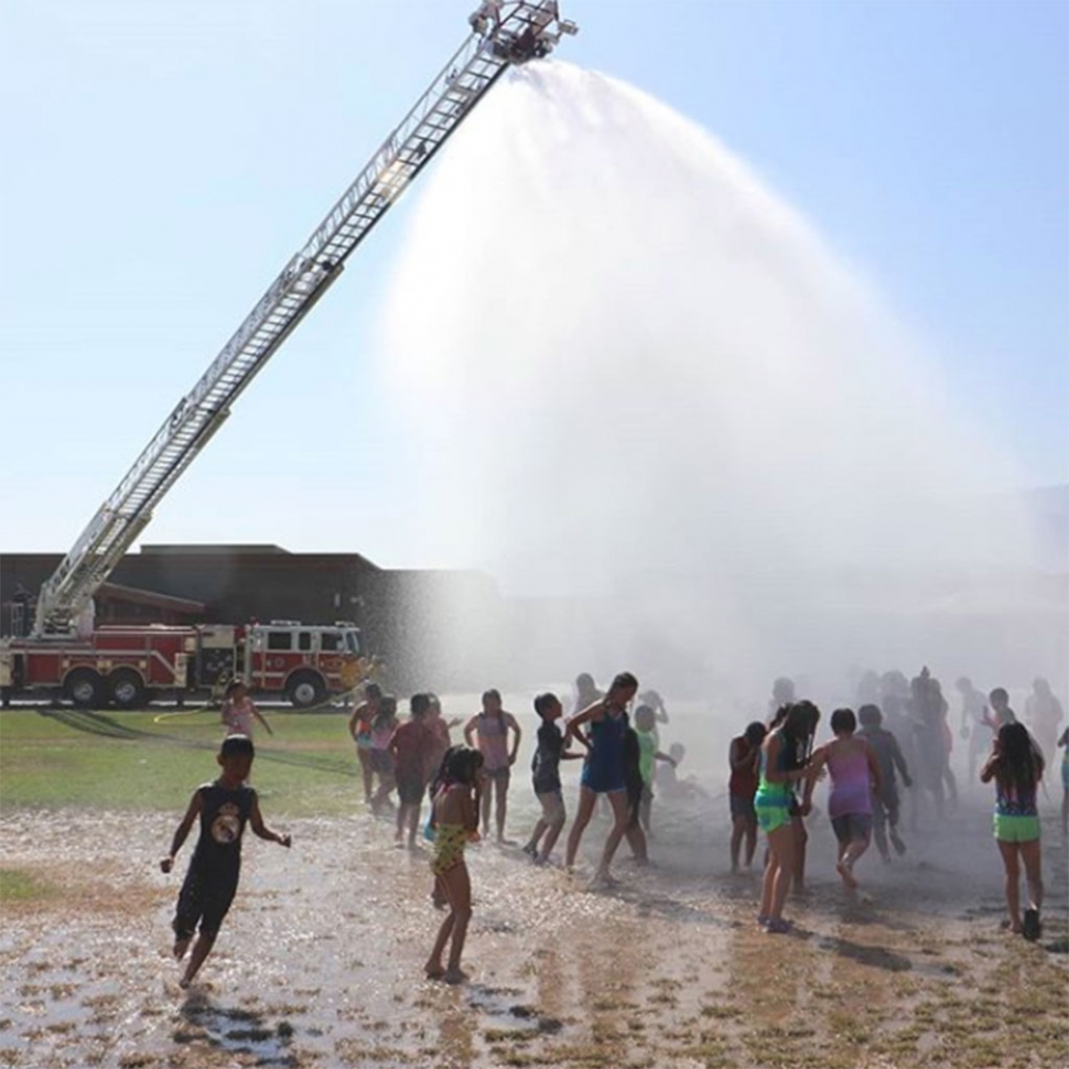 Fillmore Fire Department visited both San Cayetano and Rio Vista Elementary school for the Annual Wet Down. Pictured
are the kids from Rio Vista enjoying the water.