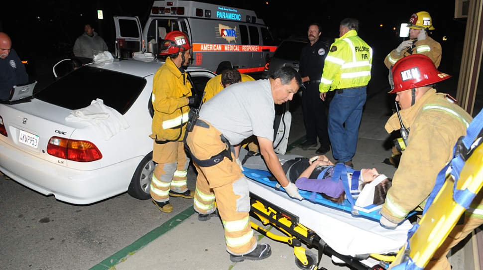 At approximately 7:45 p.m. Sunday, a Honda Civic was struck by another vehicle, and the driver of that vehicle fled the scene. The driver and one passenger in the Honda were both taken by ambulance to a local hospital for observation. The extent of any injuries was not reported. A Ventura County Sheriff’s deputy told the Gazette that they had a description of the other vehicle and a search was underway to find it. Above, Fire Chief Rigo Landeros assists in recovering the driver of the Honda.