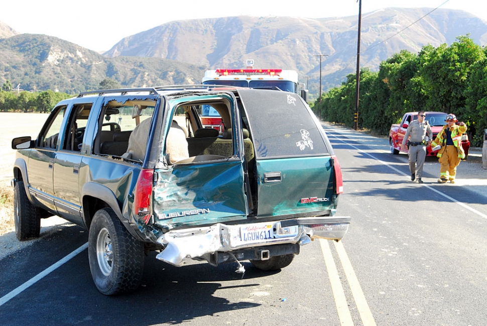 Five persons were reported in the Suburban, including three children and two adults. The Suburban was thrown approximately 50 feet into a dump truck parked in front of a residence near the intersection. Injuries to the occupants of the Suburban were not available. 