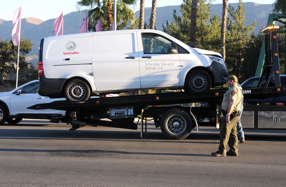 On Wednesday, November 11th at 3:44pm a collision occurred at the intersection of Mountain View and Ventura Street involving at least four cars. Pictured is a white Schindler Elevator work van being towed away from the scene and (below) a dark colored SUV which was also involved in the crash. Cause of the accident is still under investigation.