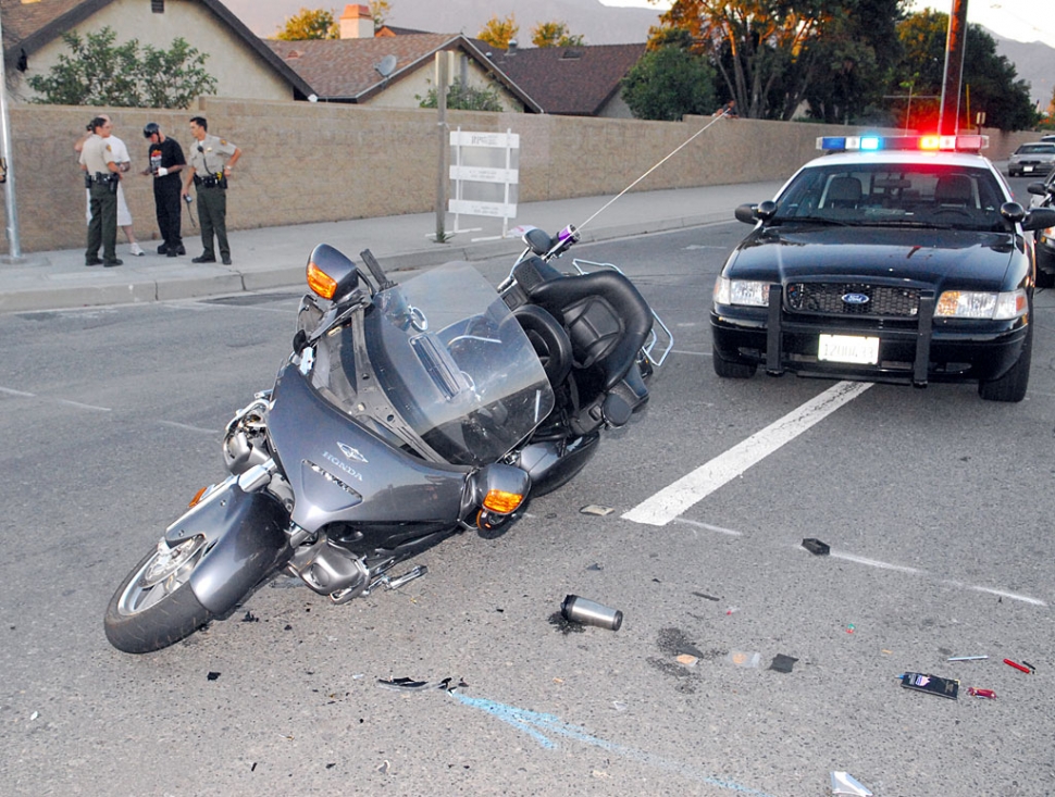 Kenneth McDermot, 63, laid down his 2005 Honda after colliding with Thomas McAdam, 67, at the corner of River and A Street. McAdam was traveling eastbound on River in his Dodge Ram; McDermot was traveling south on A Street and was treated for minor injuries at the scene. Both vehicles were towed away.