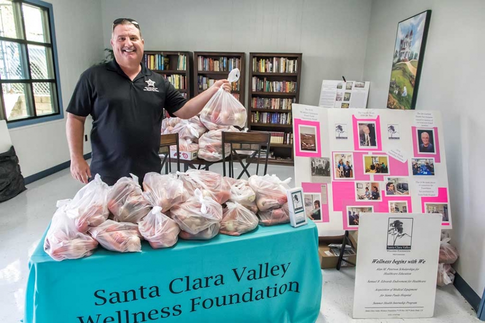 Fillmore Police Chief Dave Wareham handed out sacks of fresh vegetables.