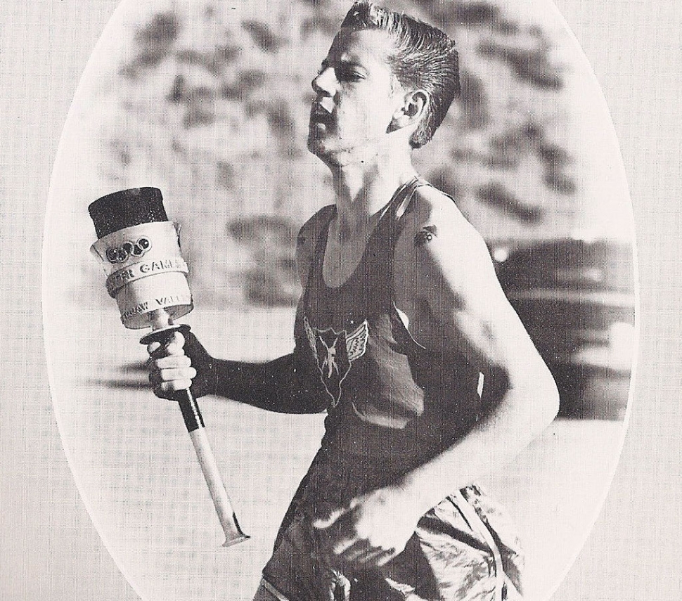 Larry Tittsworth, Class of '61, running with the Olympic Torch.