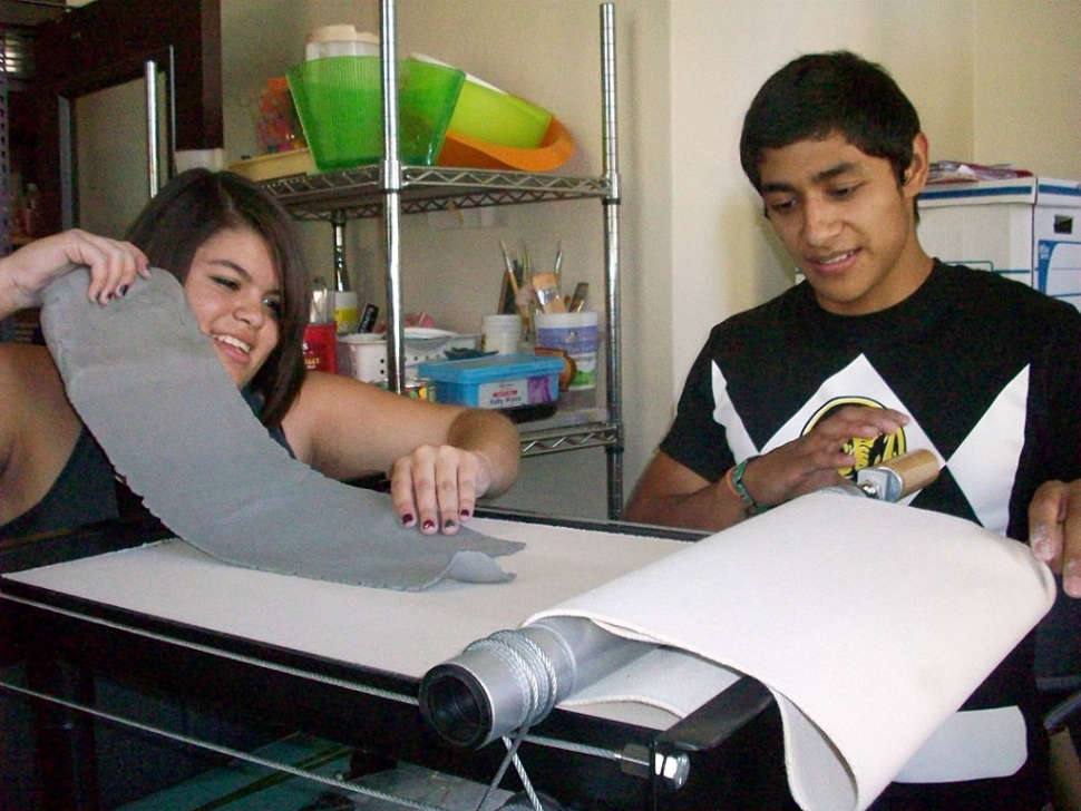 Fillmore High School Ceramic students Brooke Alvary and Kyle Castaneda are using the new slab roller purchased with funds donated by the Ebell Club of Fillmore. The Fillmore High School Art Department is grateful for Ebell Club’s continuing support of the arts.