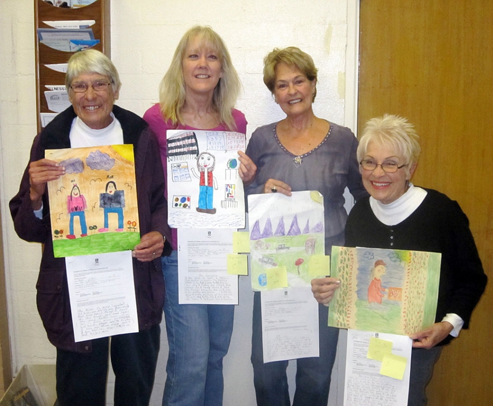 Former art instructor (and contest judge) Sarah Hansen, Jane David, artists (and contest judges) Wana Klasen and Judy Dressler show some of the submissions to the Woman of Influence Art Contest, sponsored by the Fillmore Soroptimist.