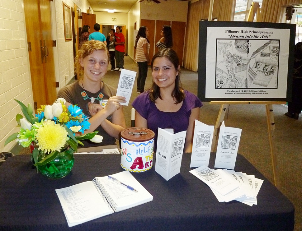 The delightful greeters for the FHS Art Show. (l-r) Diana J. Gumber, Senior at FHS, also the artist who drew the picture for the postcard and brochure and Briana Vazquez, a senior at FHS.