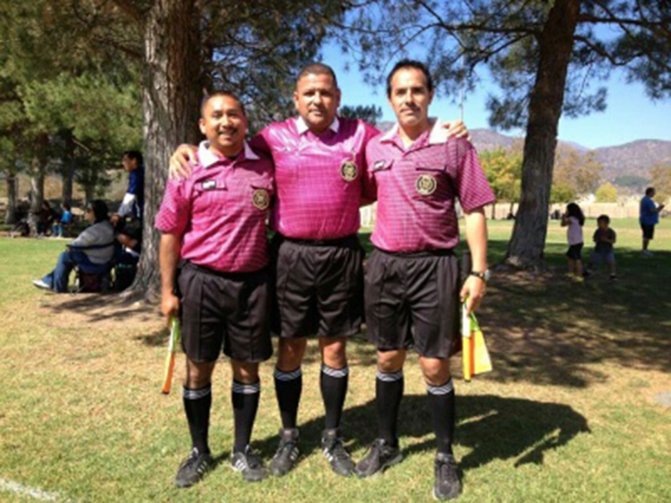 AYSO referees and youth referees showing their support for breast cancer awareness at Shields Park. 