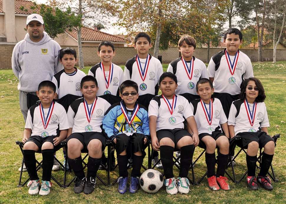 Top row left to right: Coach Ignacio Calderon, equipment manager Joel Garza, Players: Cristian Mijares, Captains: Enrique Gutierrez and Julian Calderon, Daniel Vaca. Bottom row: Geovany Lopez, Andres Avila, Goal Keeper Cristian Hernandez, Daniel Munoz, Alejandro Rodriguez and Jose Hinojosa. (Not in picture) Coach Octavio Hernandez, player Dante Galvan and team mom Alyssa Calderon.