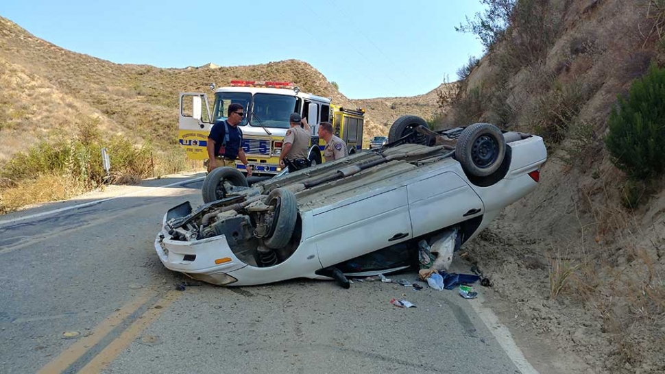 On Saturday afternoon, a car rolled over on Balcom Canyon Road. The female driving the vehicle climbed out, jumped into another vehicle and took off. CHP has taken over the investigation. Photo Courtesy Fillmore Fire Department.
