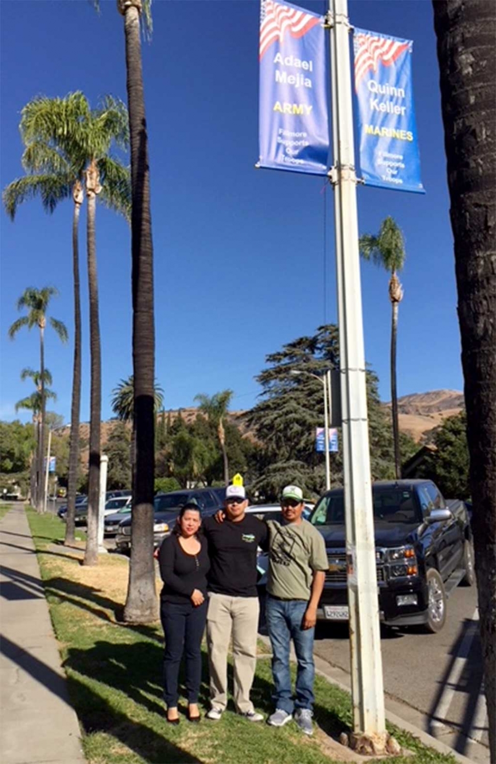 A New Military Banner was installed for Adael Mejia (center) representing the US Army along with his parents Adrian Mejia Hernandez and Laura Mejia. Photos courtesy Virginia De La Piedra.