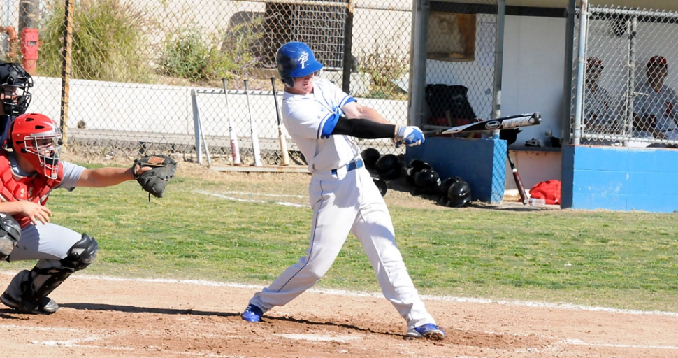 Christian Conaway hits a single up the middle. Fillmore lost to Bishop Diego 3-2, last Friday, April 1.