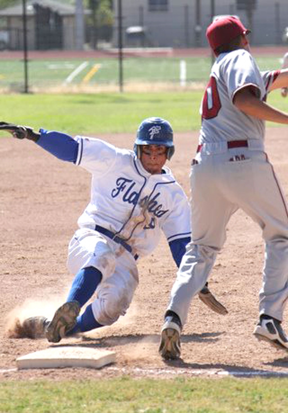 Alan Lizaraga slides safely into third base. Christian Conaway was 2 for 4, Jess Cazares and Francisco Ortiz were 1 for 3 including a double and an RBI.