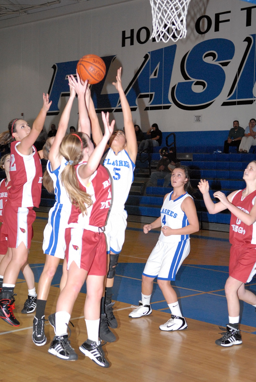 Tuesday, January 18, Fillmore played Bishop Diego. Above Ashley Coert #5 rebounds the ball. Also pictured Kayla Grove #4.