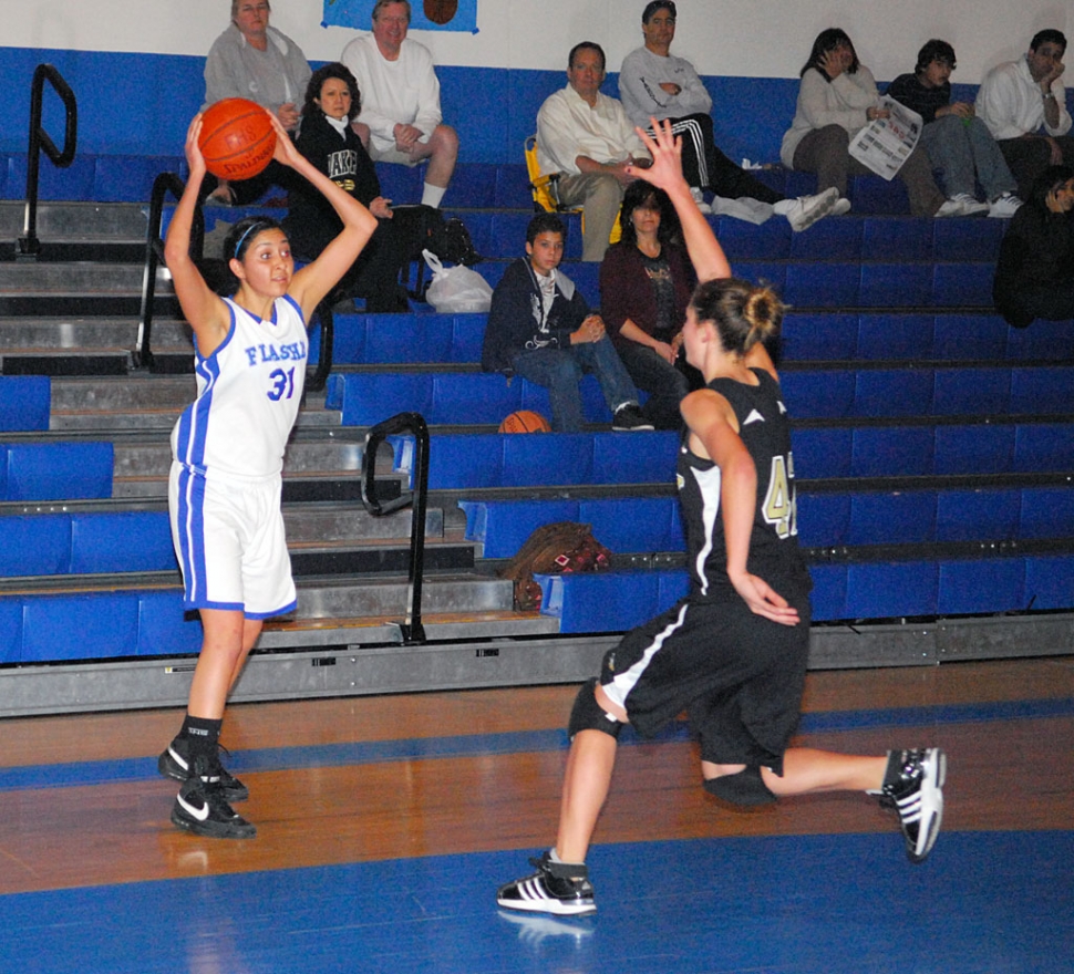 Jazzmine Galvez looks to pass the ball and keep it away from Oak Park.