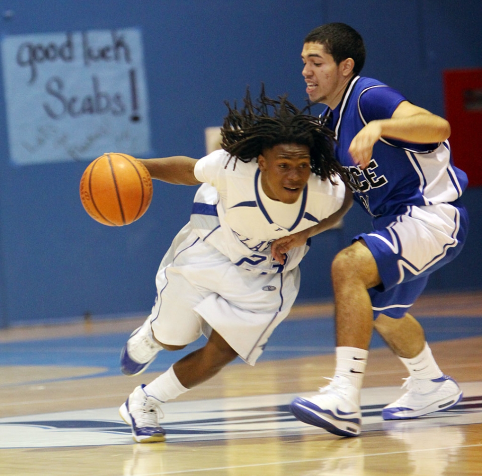 Troy Hayes drives through Price’s defense for a basket.