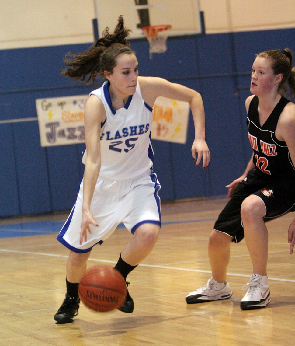 Jillian Wilber dribbles around Santa Ynez’s defender for a basket. (Basketball photos by David Watson)