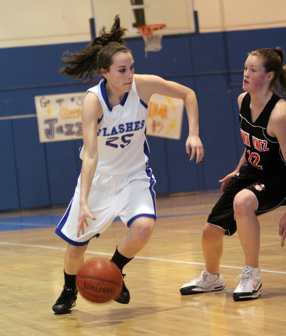 Jillian Wilber dribbles around Santa Ynez’s defender for a basket. (Basketball photos by David Watson)