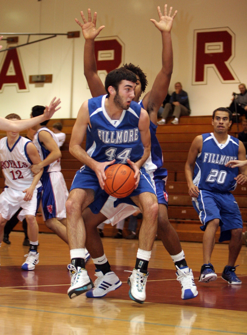 Arlen Appenzeller tries to move around the defense last Friday. Also pictured Jesse Sanchez.