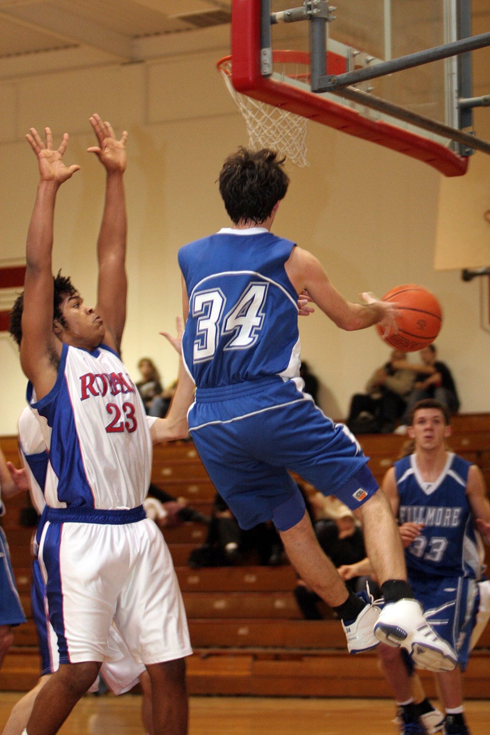 Mike Watson passes the ball to Noah Aguirre to avoid the block from San Marcos.