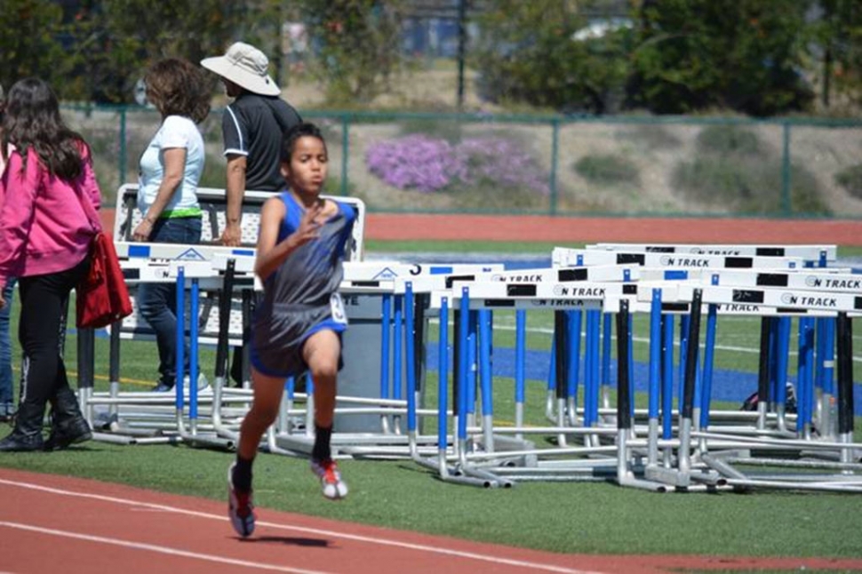 1st place 4X400m winners Midget Boys, Jovon Grandison running anchor