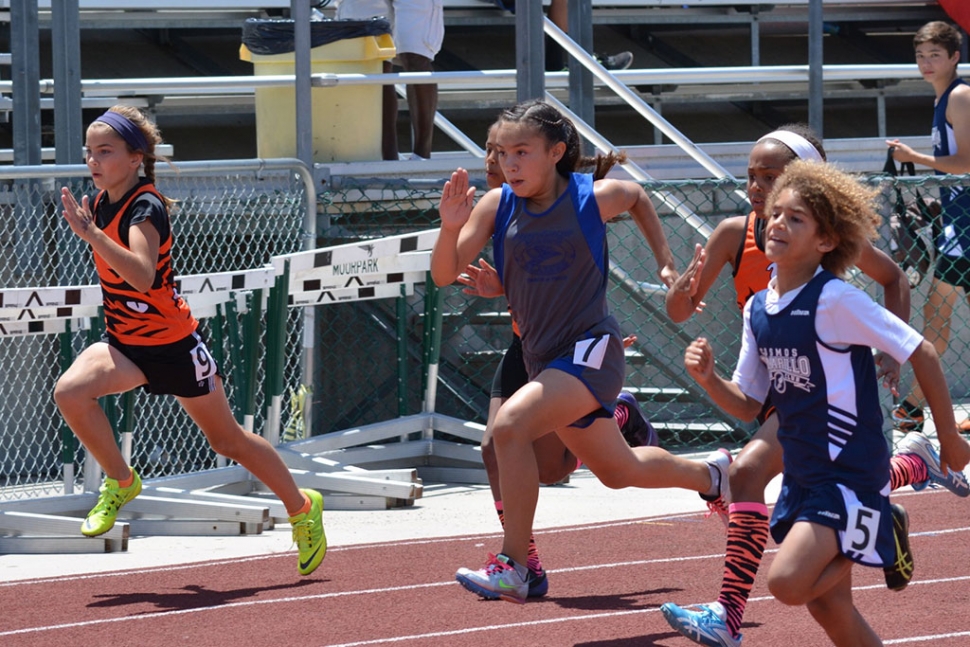 Emily Briseno (center) will continue to our Co Conference Championships in both 100 meter and 400 meter dashes.