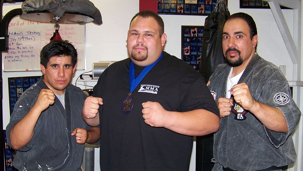 Robbie Aguilar (center) with instructors Michael Torres (left) and Sifu Paul Perce (right)