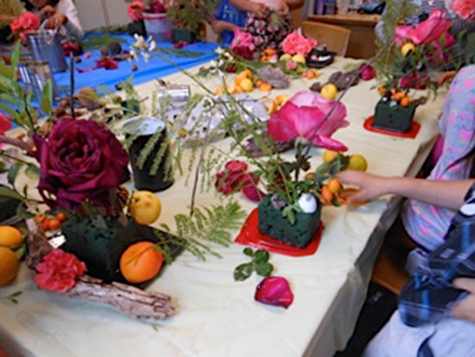 Boys & Girls Club members enjoyed making arrangements with flowers and fruit.