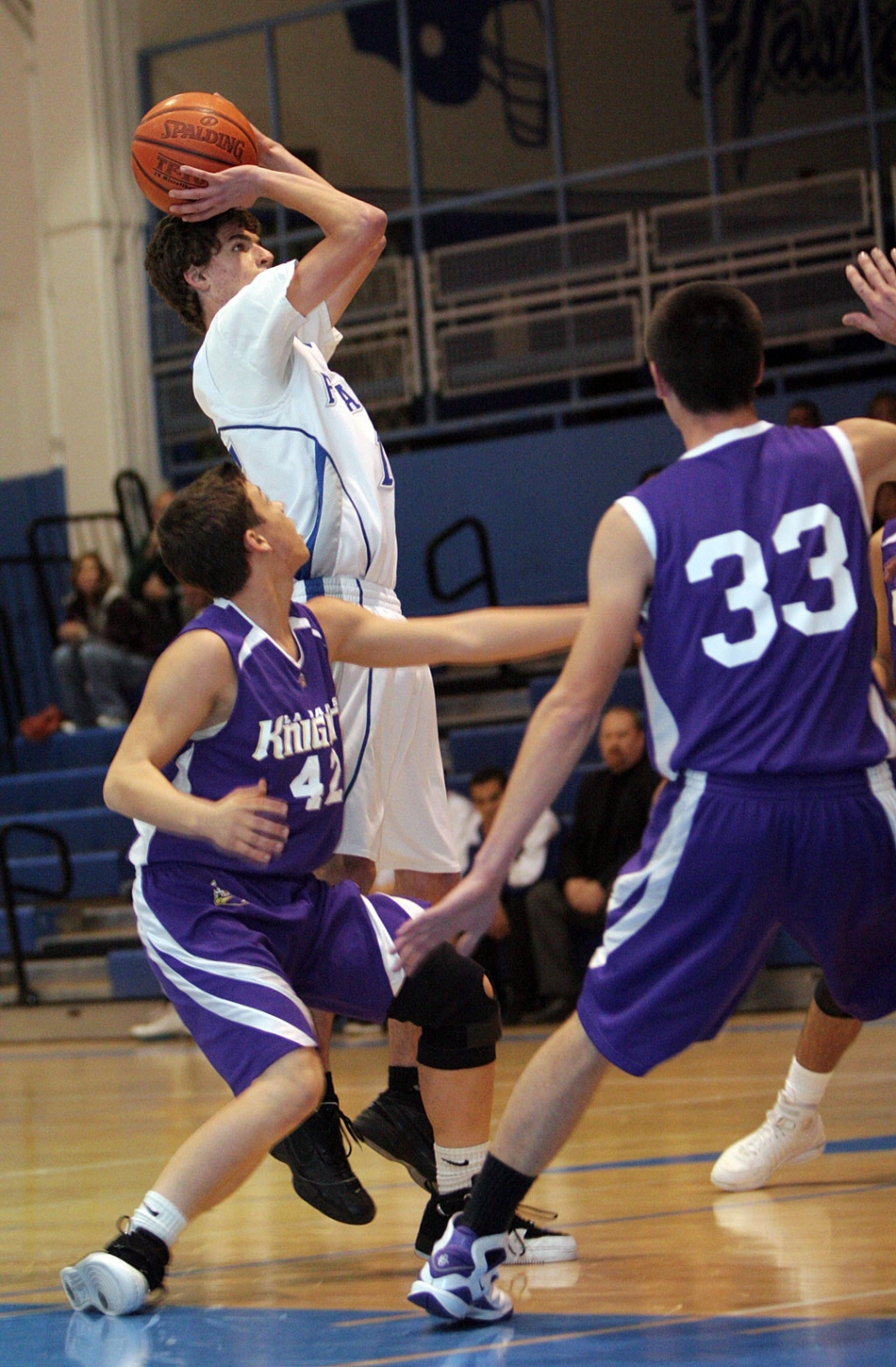 Mike Watson makes the basket against L.A. Baptist. Watson had a great defense game with 7 rebounds. Highlights: Noah Aguirre had 25 points, 7 rebounds and 5 steals, Chris De La Paz had 9 points and 10 rebounds, and James Nelson had 10 points, 8 rebounds, and 4 assists. According to Coach Sebek, Noah led the team offensively on 11 of 24 shooting and 3-4 from the line. Mike Watson played great defense and grabbed 7 rebounds. Chris De La Paz had a successful first game on varsity as a tenth grader. The team shot well from the free throw line, going 16 for 18. Fillmore beat L.A. 60-43 with an overall record of 6-8.