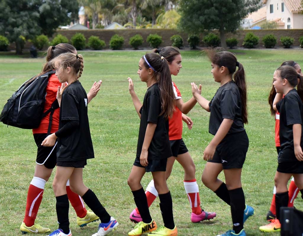 California United 11-U girls are shown congratulating their opponents at the end of the game this past weekend after a great effort. Photo Courtesy Evelia Hernandez.