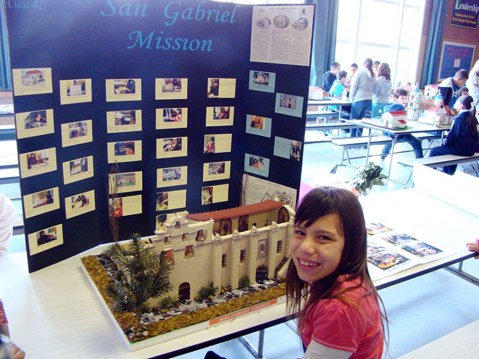 Melia Galindo is shown with her 4th grade California Mission project.