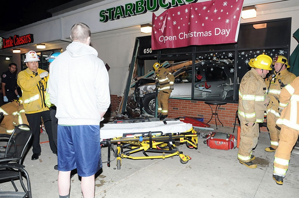 Michael Cedarland (Above in gray shirt and blue shorts) inspect his SUV, after he crashed into Fillmore Starbucks on December 13, 2011. Cedarland’s apparent history of seizures has been brought into question.