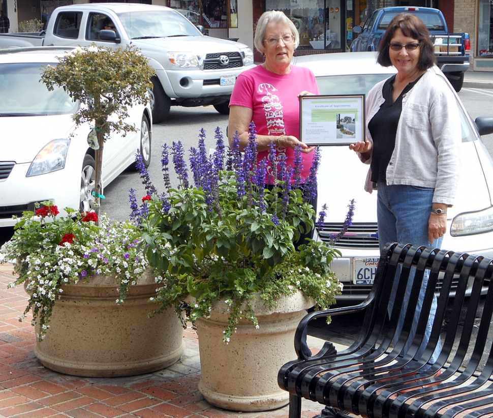 Charlene Smith receives an award of appreciation for sponsoring two of the Central Avenue pots that were replanted. Civic Pride Committee is hoping to complete this project before the 4th of July and needs 13 more sponsors.