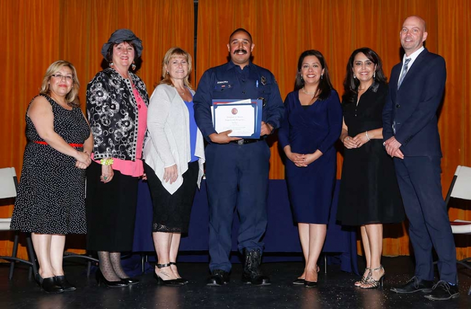 Firefighter of the Year Jason Arroyo, pictured center.