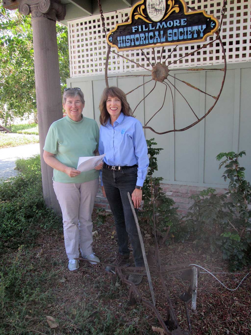 On October 6, 2015,  the Fillmore Historical Museum was pleased to accept a donation of $3,000.00 from Leslie Klinchuch representing Chevron Corporation.   The donation will be used for the ongoing projects and programs of the Museum.  The Museum currently has displays and photos representing the individuals and operations of the old Fillmore Texaco Refinery from the beginnings through WW II to its dismantling in  1951 and its final end in 2004.  The site was home for years to many of  the oil company employees and their children. The photo was taken in front of the Museum sign which is enhanced by an old wagon wheel from the turn of the last century rescued from a trash dump at the site.  
