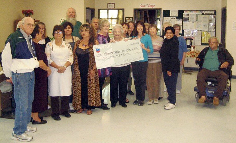 Leslie Klinchuch with board members Donna Voelker and Neva Pickett along with other board members and center participants.