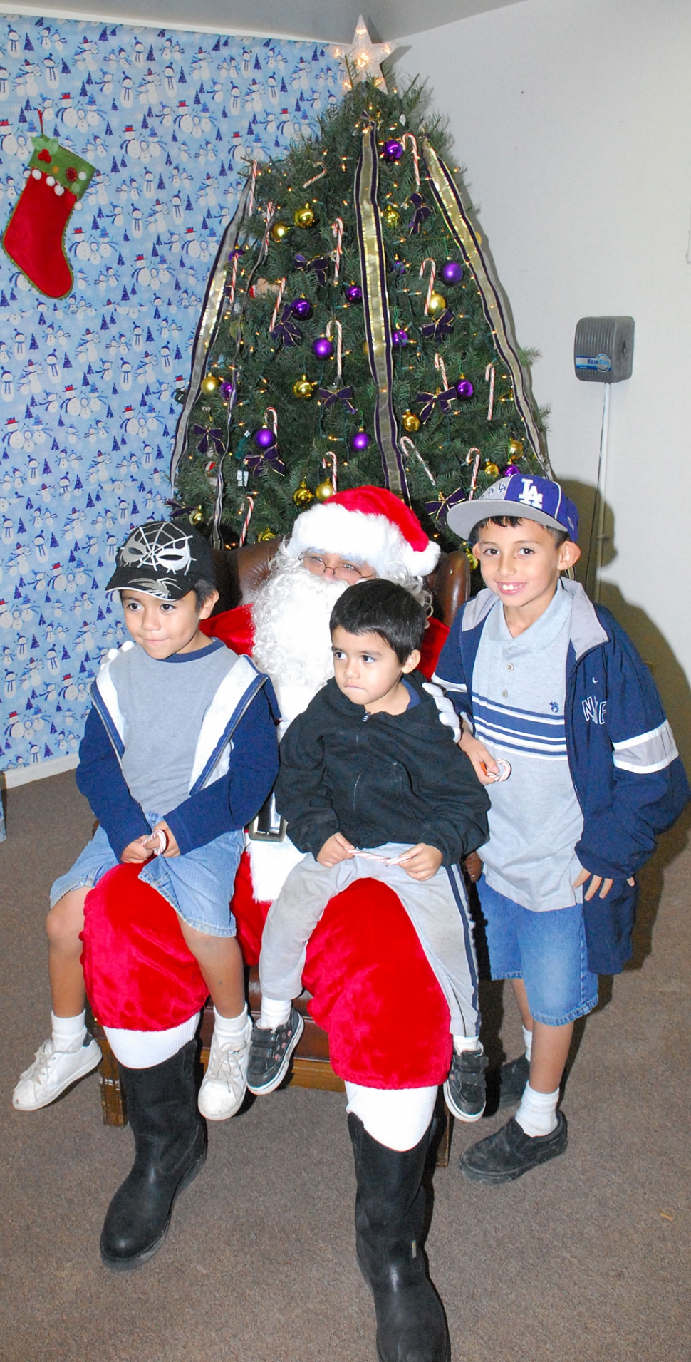 The Annual Police Storefront toy giveaway was held on Monday, December 22nd. Over 1,112 people attended the event. Santa “Steve Conaway” Claus is shown with a couple of true Santa devotees. The law office of Taylor, Scoles, Bartels provided 600 new jackets for the kids; St. Francis Church donated 20 Christmas trees; and Rigo Landeros, of Fillmore Fire Dept., donated 60 turkeys. Each child received three gifts.