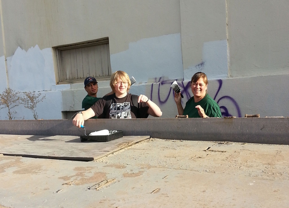 Christie Neal, wife of council candidate Rick Neal, and their son, along with council candidate Manuel Minjares were part of the community graffiti clean-up last Saturday.