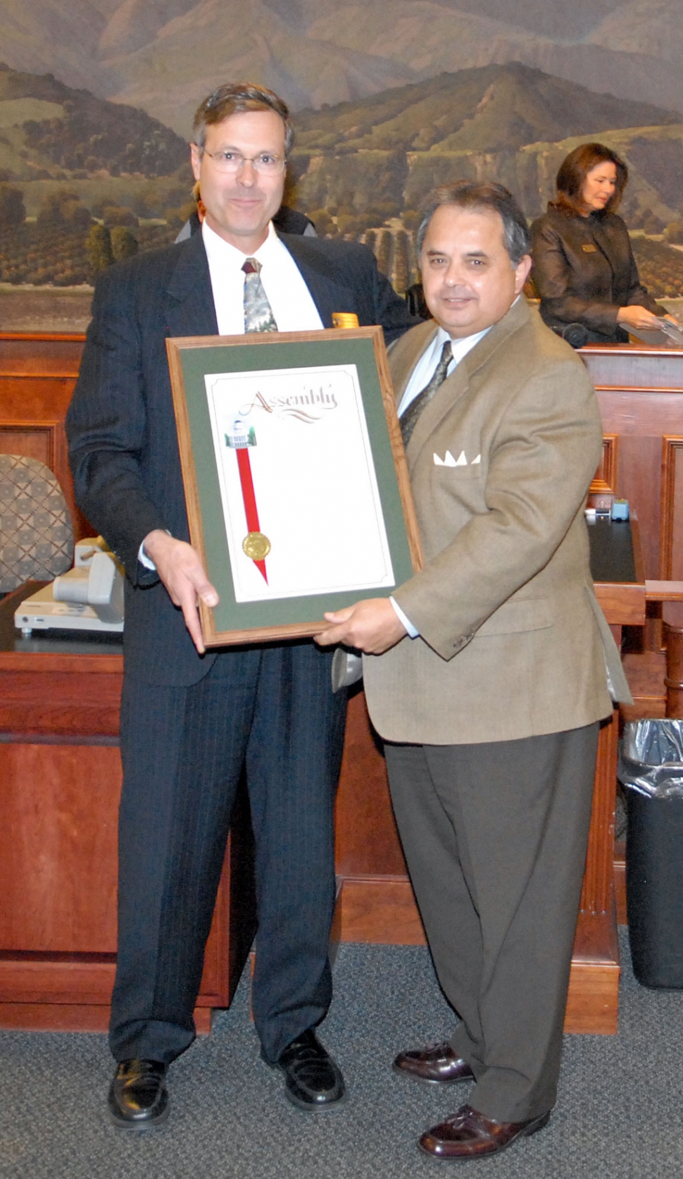 Former Fillmore Mayor Ernie Villegas, right, presents outgoing City Engineer Bert Rapp with a proclamation from our newly elected State Assemblyman, Jeff Gorell, 37th District, honoring Rapp for his nearly 20 years of outstanding work for the City of Fillmore. Villegas complemented and congratulated Rapp as someone he worked with personally during his years as mayor. Rapp received numerous honors from state, county, and local
establishments, each acknowledging the quality of his work and his personal integrity. He received several standing ovations as well.