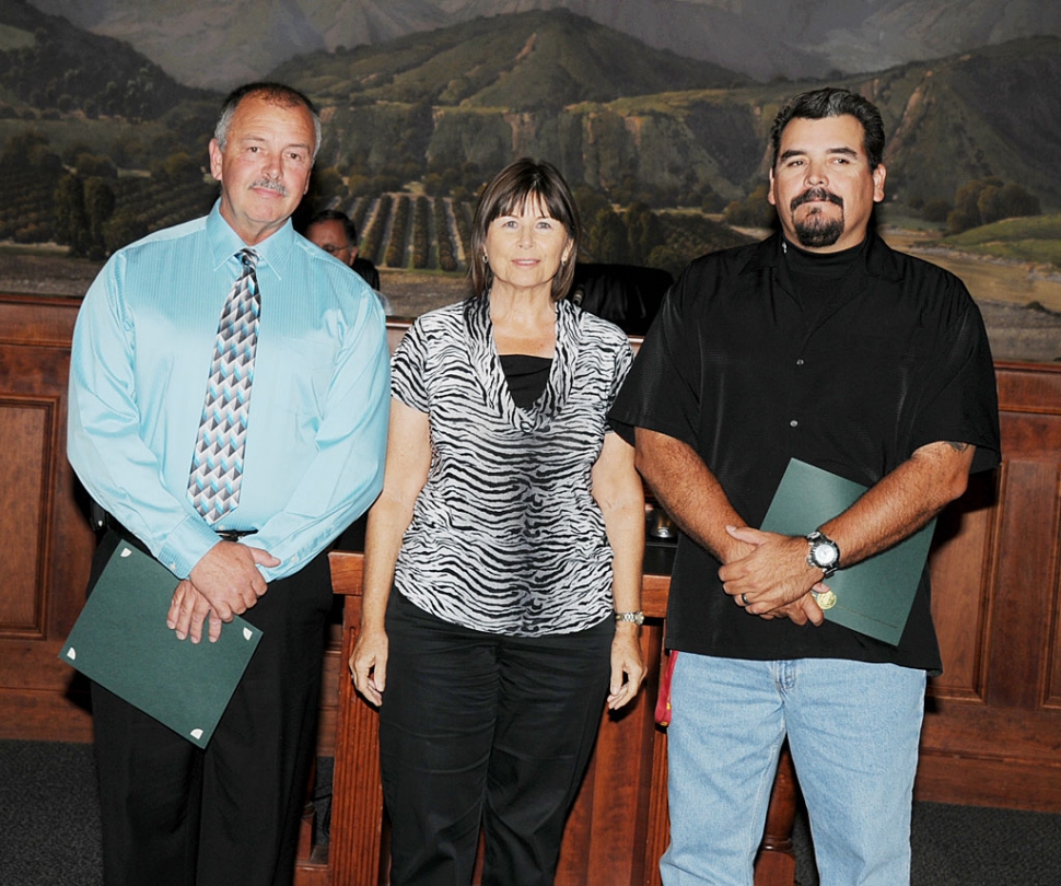 At Tuesday night’s City Council meeting the city recognized Public Works Supervisor David Smallwood (left) and Mark Avila (right) for their Aquatics Center maintenance efforts. Also pictured Mayor Gayle Washburn.