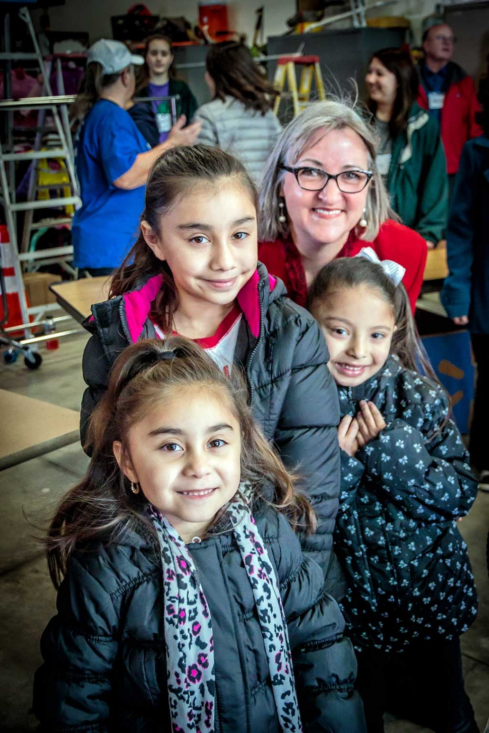 Saturday, December 17th Laura Bartels from the Santa Clara Valley Legal Aid’s Group was giving away brand new warm winter coats to needy children of the Santa Clara Valley who were standing outside in line to receive their toy from Santa. Every year the group fundraises money to purchase brand new coats to hand out. Photos courtesy Bob Crum.