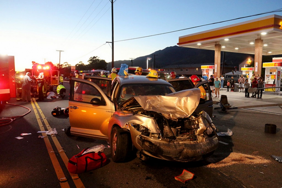 A traffic signal pole was knocked down by a Ford F210 Pickup truck as the result of an collision with a Chrysler PT Cruiser.