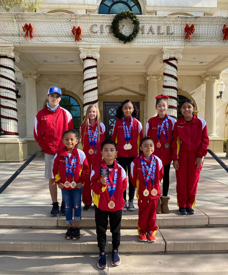 On Saturday, December 5th, the Fillmore Youth Cross-Country Team, the Shockwaves, traveled to Tallahassee, Florida to compete in the Amateur Athletic Union National Cross-Country Championships. Pictured above is the Shockwaves tea: left to right-back row: Joshua Estrada, Julie Bakholdin, Emily Arriaga, Paola Estrada, and Niza Laureano. Front row: Aaliyan Tarango, Mason Arriaga, and Leah Laureano.