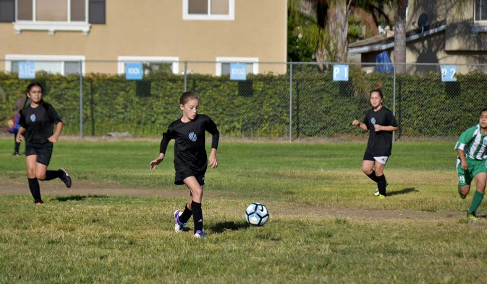 Part of the great CU defense, Isabel Hernandez (left) and Mikayla McKenzie as Brooke Nunez (middle) takes it back the other way. Photo courtesy Evelia Hernandez.