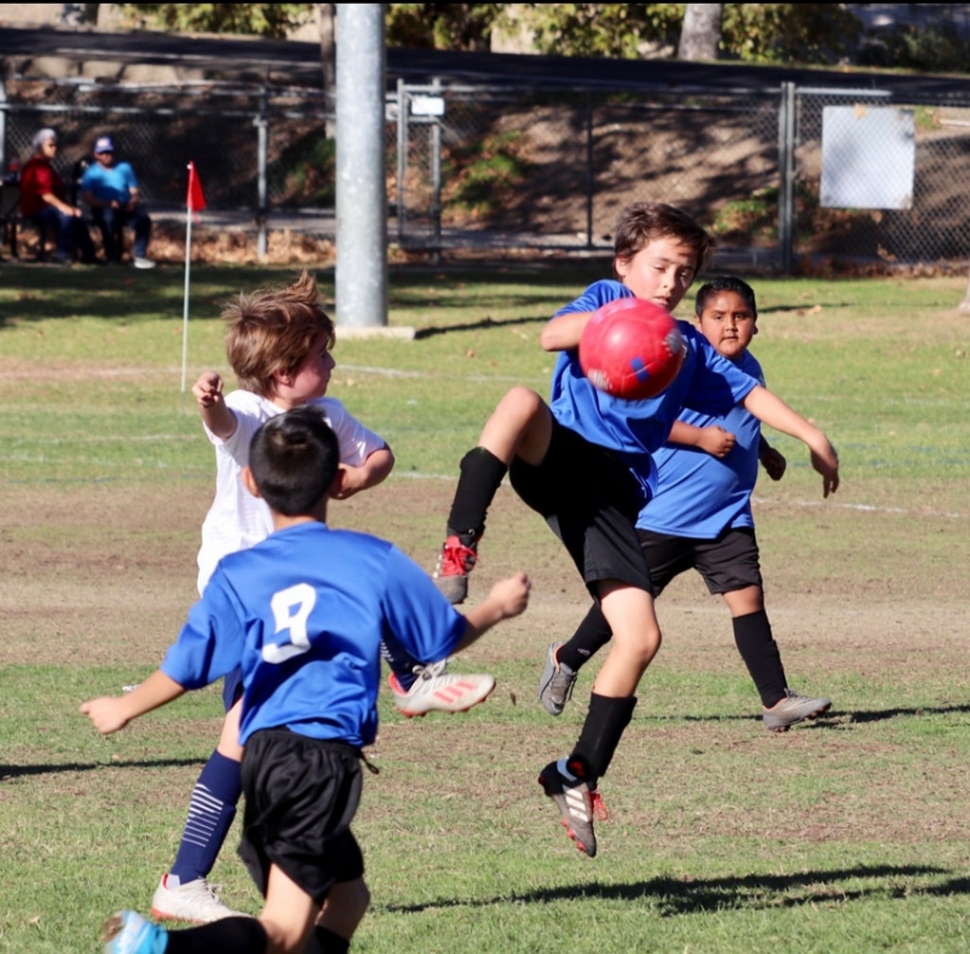 Pictured is a California United 2010 Boys Bronze Alpha player as he takes the ball from his opponent in this past weekend’s game. Photos Courtesy Erika Arana.