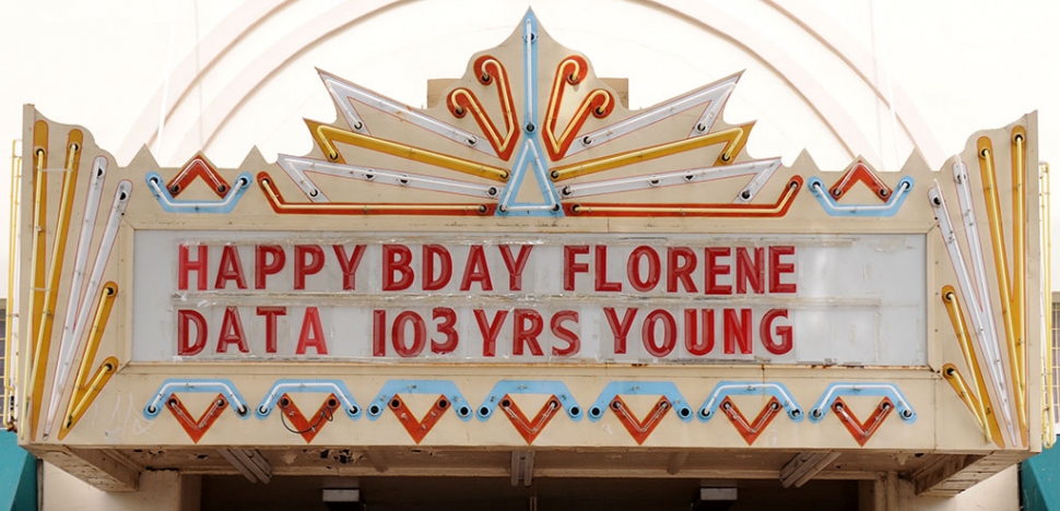 Florene Data turned a century-plus-three in May and Fillmore wants to help her celebrate. On Monday, June 8, at noon in front of Fillmore City Hall, come wish Florene a happy birthday! Instead of gifts, please go by a dollar store and pick up something patriotic; a flag, a hat, anything red, white & blue and gift it to her. Florene is famous for driving around Fillmore in her scooter, complete with the American flag flying in the wind as she cruises down Central Avenue. Fillmore's Towne Theatre marquee sends the message we all want to deliver to Florene HAPPY BIRTHDAY!