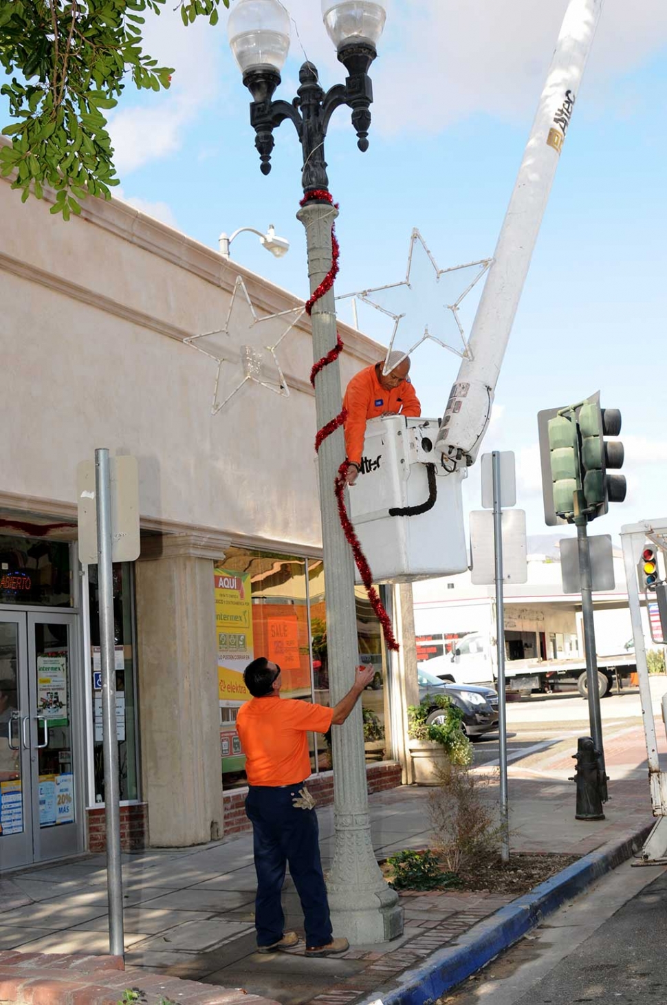 The City of Fillmore is getting into the Christmas Spirit! On Monday morning city employees were spotted downtown decorating the light poles with garland and giant stars to get ready for the Christmas Season, as well as for the Annual Lion’s Club Christmas Parade which will take place this Saturday, December 2nd at 10am in downtown Fillmore.