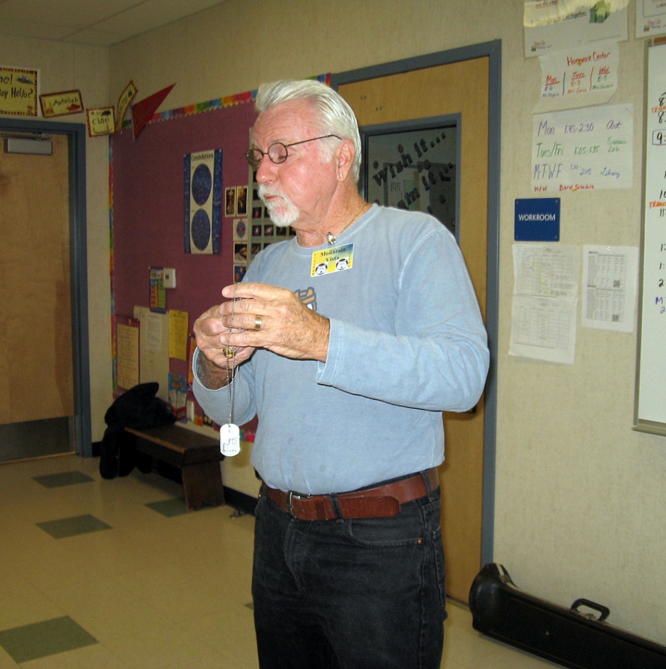 Mr. Diaz explaining to the class about his dog tags.