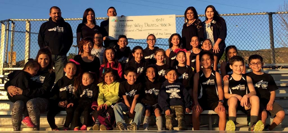 Bank of the Sierra donates $4,000 to Fillmore Condors Cross Country. Accepting the check is treasure, Francisco Velazquez, President, Erika Arana, Coach Rafael Laureano and Condor athletes.